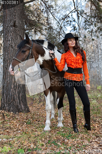 Image of Young Woman And Horse