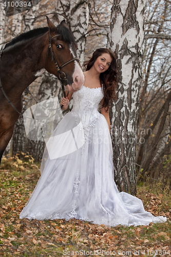 Image of Young Woman And Horse