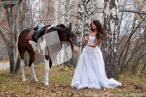 Image of Young Woman And Horse