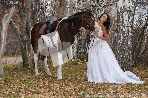 Image of Young Woman And Horse