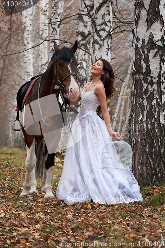 Image of Young Woman And Horse