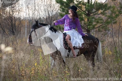 Image of Young Woman And Horse