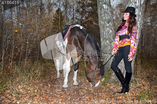 Image of Young Woman And Horse