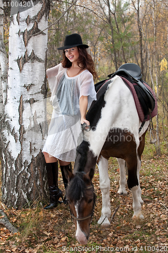 Image of Young Woman And Horse