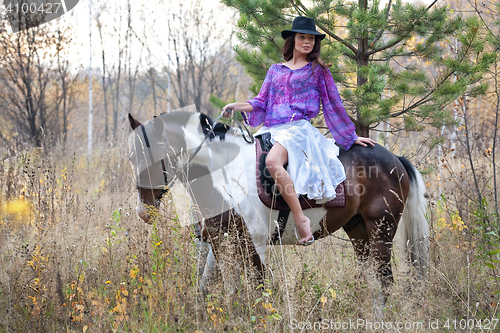 Image of Young Woman And Horse