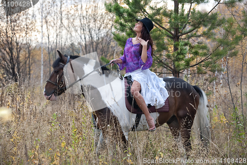 Image of Young Woman And Horse