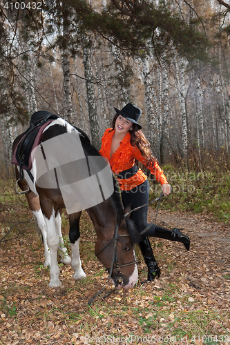 Image of Young Woman And Horse