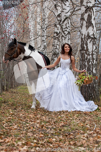 Image of Young Woman And Horse