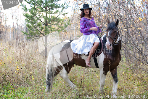 Image of Young Woman And Horse