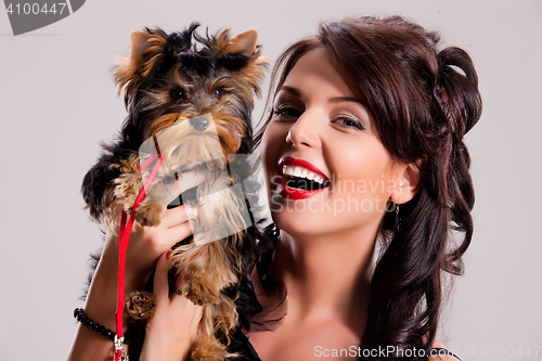 Image of Young Woman With A Little Dog