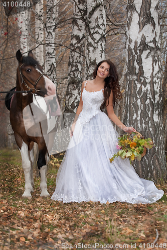 Image of Young Woman And Horse