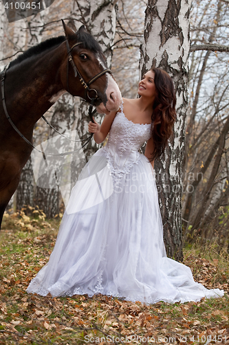 Image of Young Woman And Horse