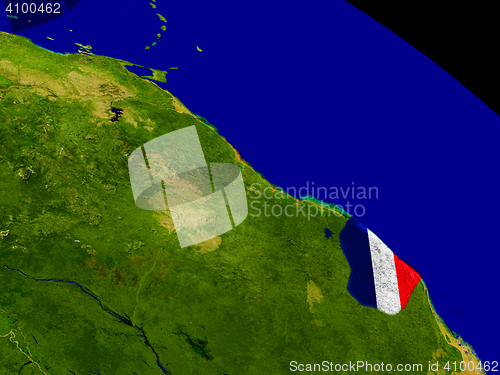 Image of French Guiana with flag on Earth