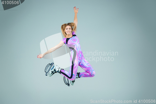 Image of The group of girls, jumping on kangoo training