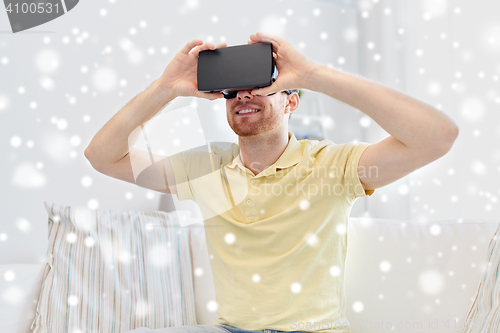 Image of young man in virtual reality headset or 3d glasses