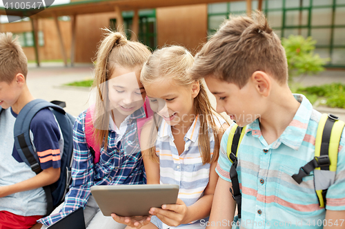 Image of group of happy elementary school students talking
