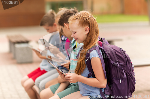 Image of group of happy elementary school students talking