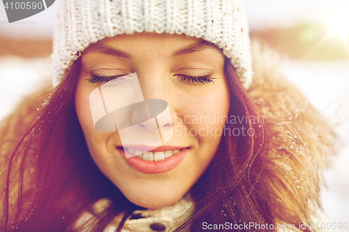 Image of happy woman outdoors in winter