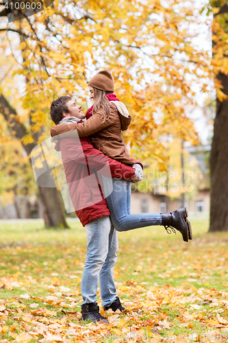 Image of happy young couple meeting in autumn park