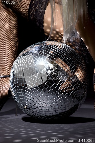 Image of fishnet stockings and disco ball