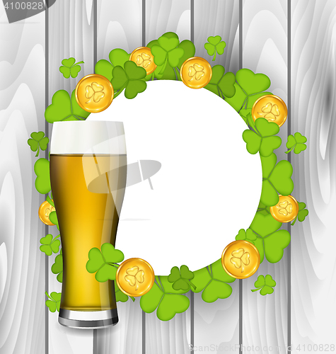 Image of Celebration card with glass of light beer, shamrocks and golden 