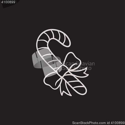 Image of Candy cane with christmas decoration sketch icon.