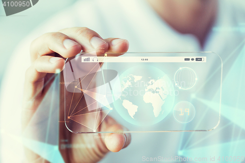 Image of close up of hand with earth globe on smartphone