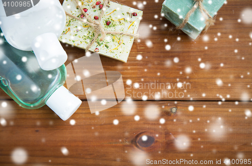 Image of handmade soap bars and lotions on wood