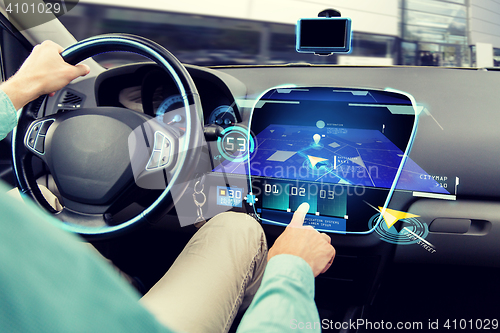 Image of close up of man driving car with navigation system