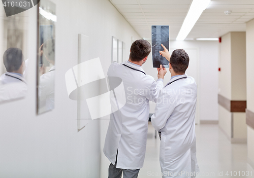 Image of medics with spine x-ray scan at hospital