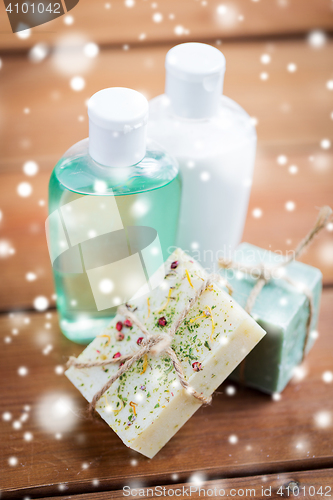 Image of handmade soap bars and lotions on wood