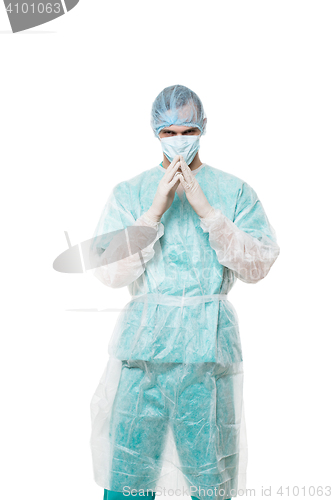 Image of Surgeon portrait. isolated on white background. focuses on reflection. fingers pyramid. praying