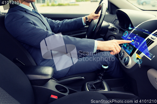 Image of close up of man driving car with navigation