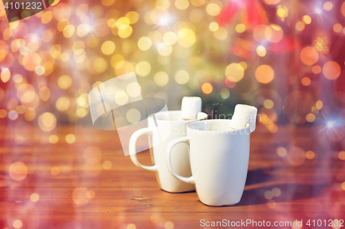 Image of cups of hot chocolate with marshmallow on wood