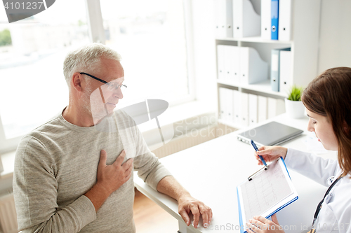 Image of doctor showing cardiogram to old man at hospital