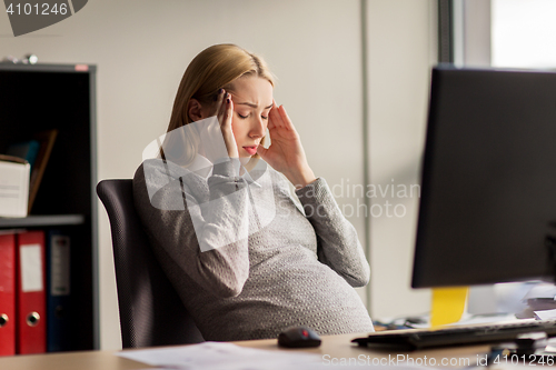 Image of pregnant businesswoman feeling sick at office work