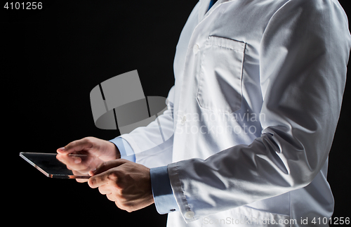 Image of close up of doctor or scientist with tablet pc