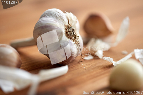 Image of close up of garlic on wooden table