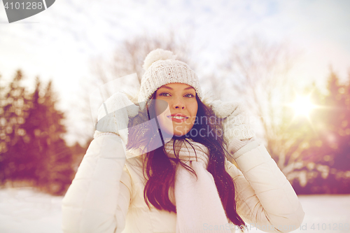 Image of happy woman outdoors in winter