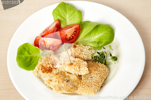 Image of roasted fish fillet covered with sesame seeds