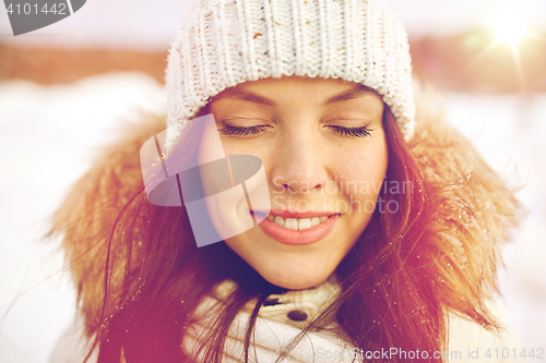 Image of happy woman outdoors in winter