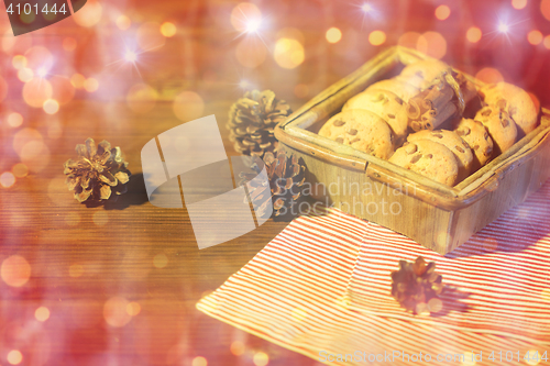 Image of close up of christmas oat cookies on wooden table