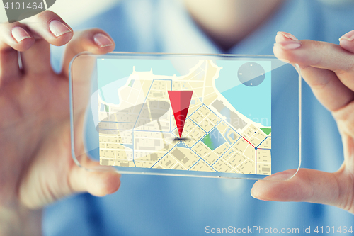 Image of close up of woman with transparent smartphone