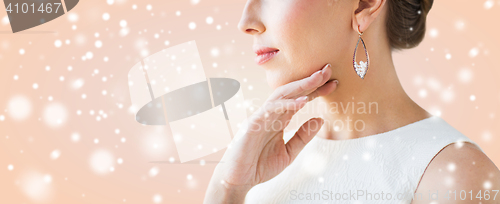 Image of close up of beautiful woman face with earring