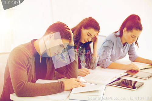 Image of students with notebooks and tablet pc at school