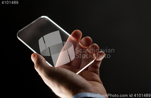 Image of close up of businessman with glass smartphone