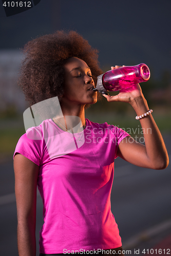 Image of Portrait of a young african american woman running outdoors