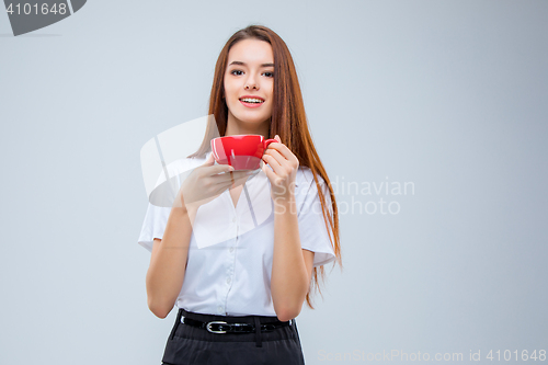 Image of The young business woman on gray background