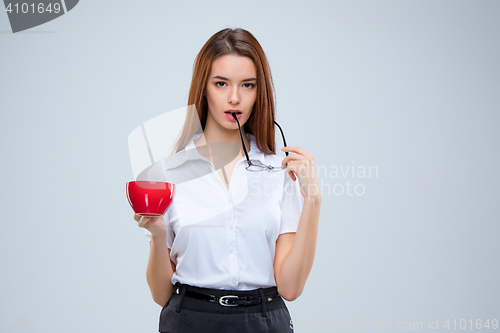 Image of The young business woman on gray background