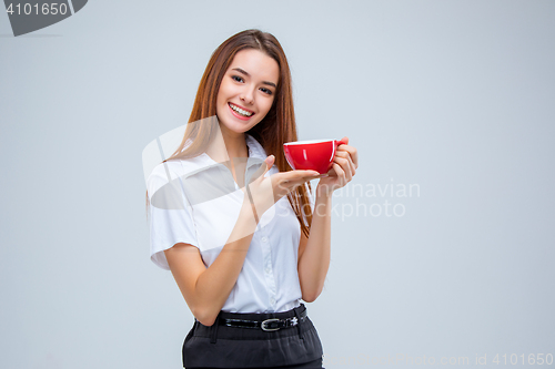 Image of The young business woman on gray background